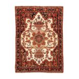 Good Malayer RugWest Iran, circa 1900The cream field of large angular tendrils around a stellar