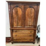 A Victorian Mahogany Linen Press, mid 19th century, with moulded and arched cupboard doors between