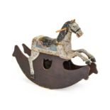 A Carved Pine Rocking Horse, painted grey and black with integral saddle, the removable body on a