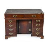 A George III Mahogany and Oak-Lined Clerk’s Desk, 3rd quarter 18th century, the leather writing