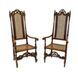 A Pair of William & Mary Style Stained Beech and Caned Open Armchairs, 19th century, the moulded and