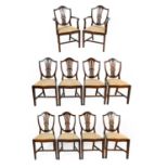 A Set of Ten (8+2) Sheraton Revival Mahogany Dining Chairs, the shield shaped back supports with