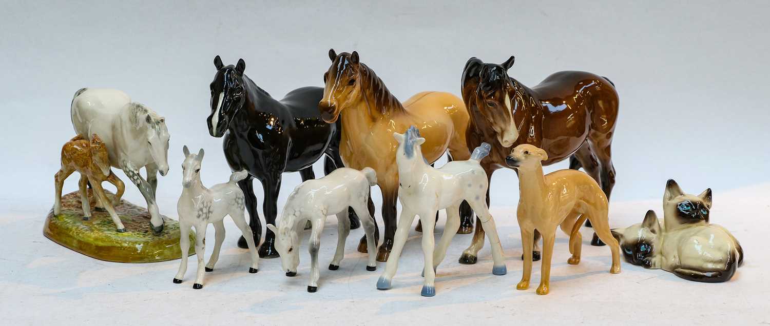 A Royal Doulton model of a mare and foal, number HN2532, Beswick horses including Highland Pony