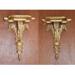 A pair of giltwood and gesso wall brackets, 19th century, the breakfront stepped shelves supported