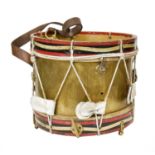 ~A brass bound and painted marching drum with leather carrying strap, 31.5cm diameter