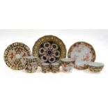 ~A collection of Royal Crown Derby Imari ware, including a pair of cabinet plates, six coffee