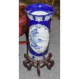 ~ A Japanese Arita cylindrical stick stand, blue ground and with flared rim, 64cm, together with