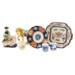 A Samson of Paris armorial porcelain dish after a Chinese original, together with a figure of Shou