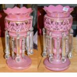 A large pair of early 20th century pink opaque glass table lustres, 37cm highCondition report: The