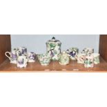 A group of Emma Bridgewater pottery, including mugs, two jars and covers, and a bowl (with