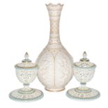 A pair of Grainger & Co Worcester reticulated vases, covers and stands (one cover a.f.), each 15.5cm