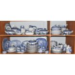 An extensive collection of Booths and other blue and white Willow pattern dinner wares (quantity)