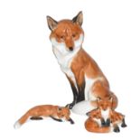 Royal Worcester model of a seated fox number 2993, 19cm high, another Worcester fox cub group, model
