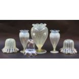 A garniture of three Victorian vaseline glass pedestal vases, together with three similar vaseline