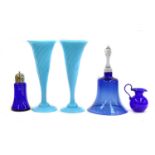 A collection of assorted coloured glassware, including a Bohemian etched and amber flash vase, and