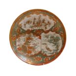 A Japenese Meiji period Kutani dish with shaped reserves containing birds and figures, on a ground
