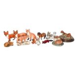 A quantity of ceramic animal models, including: a Royal Doulton flambe fox, Royal Copenhagen fawn