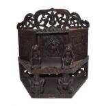 A carved hardwood Asian wall shelf