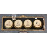 A Victorian floral needlework picture in a circular frame; a set of four coloured prints of the '