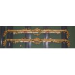 A pair of 19th century gilt and carved pelmets decorated with scrolls and floral swags, each 234cm