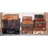 Twelve various leather and fabric suitcases of varying sizes and designs, together with a similar