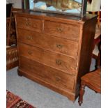 A 19th century pitch pine four-height straight front chest of drawers, the locks stamped Maple & Co,