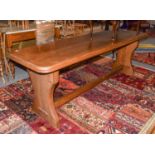 An oak refectory table with a trestle base and moulded slender rectangular top, 216cm by 66cm by