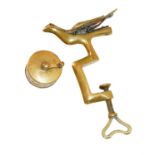 Brass Hemming Bird Clamp, with textured body and glass eyes, 14cm by 9cm; and a measuring tape (2)