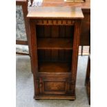 A Titchmarsh & Goodwin carved oak bookcase of small proportions, 47cm by 27cm by 95cm
