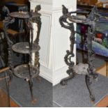 ~ A Victorian cast iron three-tier plant stand, together with another Victorian cast iron plant