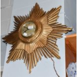 A synchronome electric sunburst wall timepiece