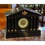 A striking slate mantel clock of architectural form, with fluted column supports, late 19th century