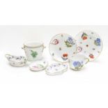 A Herend porcelain teacup, saucer and side plate, painted with fruit and flower sprigs, a