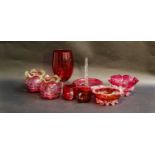 A quantity of Victorian and later cranberry glass items including baskets and decanters etc (one