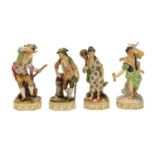 A set of four Royal Crown Derby figures for the elements, Earth, Water, Air and Fire, modelled by