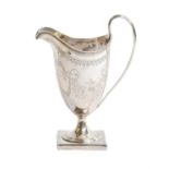 A George III silver cream jug, by Peter and Ann Bateman, London, 1799, helmet-shaped and on square