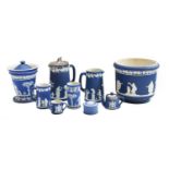 Quantity of Wedgwood blue Jasperware including a pair of candlesticks, a chamberstick, biscuit