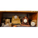 A selection of clocks including Victorian black slate and malachite set striking mantel clock, a