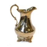 A Victorian silver cream-jug, by D. and C. Houle, London, 1858, tapering and on four scroll cast