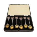 A quantity of silver items, mainly cased including a set of six spoons with enamelled terminals