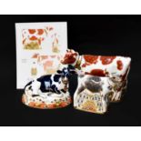 Royal Crown Derby Imari paperweights; Daisy Cow (with print of original design), Fresian Cow '