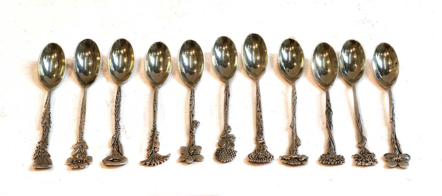 A set of eleven Tiffany floral demitasse spoons