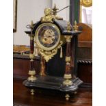 Victorian black slate and marble striking mantle clockCondition report: the case with surface