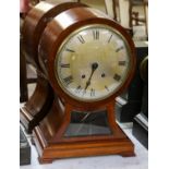 A mahogany balloon shaped quarter striking table clock, movement stamped W&H Sch