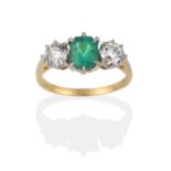 An Emerald and Diamond Three Stone Ring