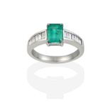 An Emerald and Diamond Ring