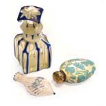 Three Various Glass Scent-Bottles, One With A Silver Cap, one clear glass cased in white and blue,