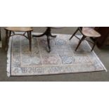 Kashmir silk piled rug, the compartmentalised field enclosed by similar borders, 184cm by 125cm,