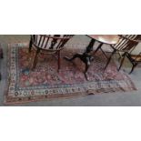 Bidjar rug, the charcoal field with madder medallion framed by ivory borders, 207cm by 125cm