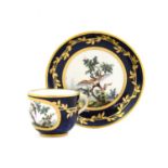 A Sèvres Porcelain Miniature Tea Cup and Saucer, circa 1765, painted in the manner of Ambroise